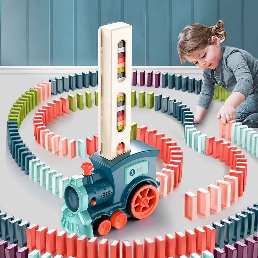 Child arranging colorful domino trails around a teal toy train with a tall loading tower