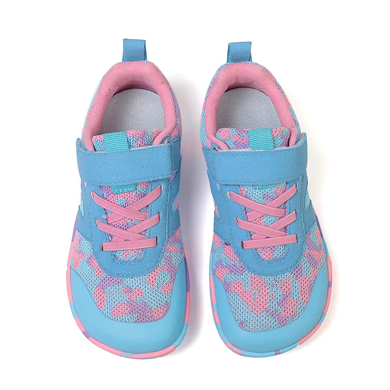 Top view of turquoise and pink sneakers showing mesh uppers, pink laces, and straps