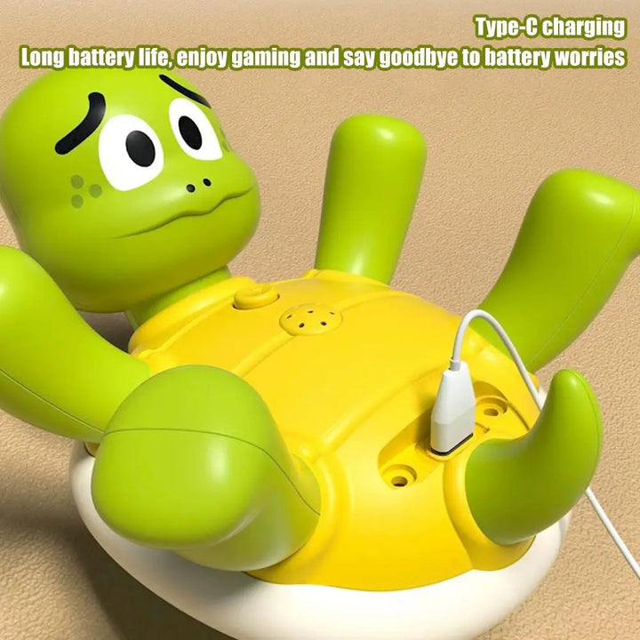 Green and yellow turtle bath toy connected to a Type-C USB charging cable.