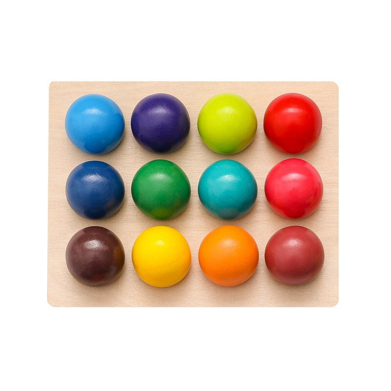 Wooden sorting board filled with twelve balls in different colors