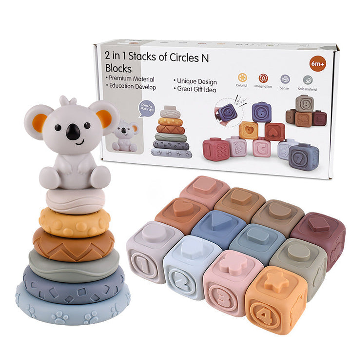 Twelve pastel cubes beside textured stacking rings, a koala figure, and product packaging
