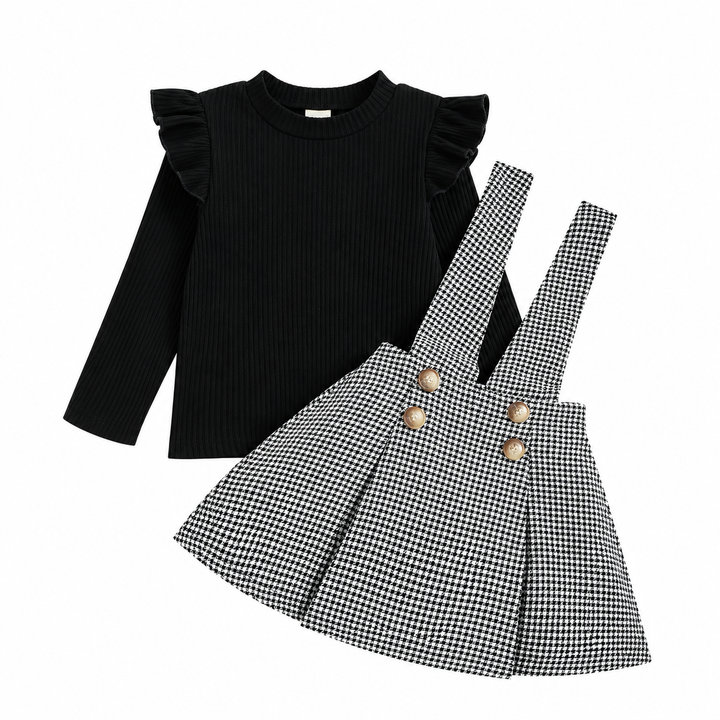 Black ruffle-shoulder top and houndstooth pinafore skirt displayed separately on a white background.
