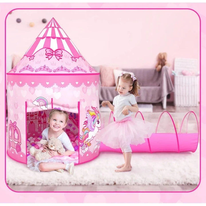 Children playing beside a pink unicorn-print tent with an attached crawl tunnel.