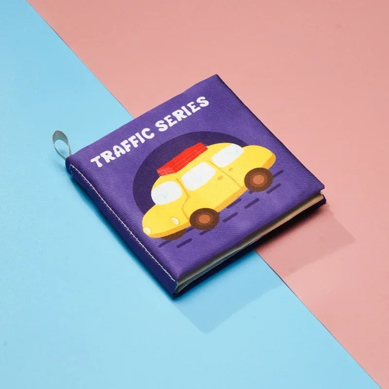 Purple vehicle-themed cloth book with a yellow car on the cover