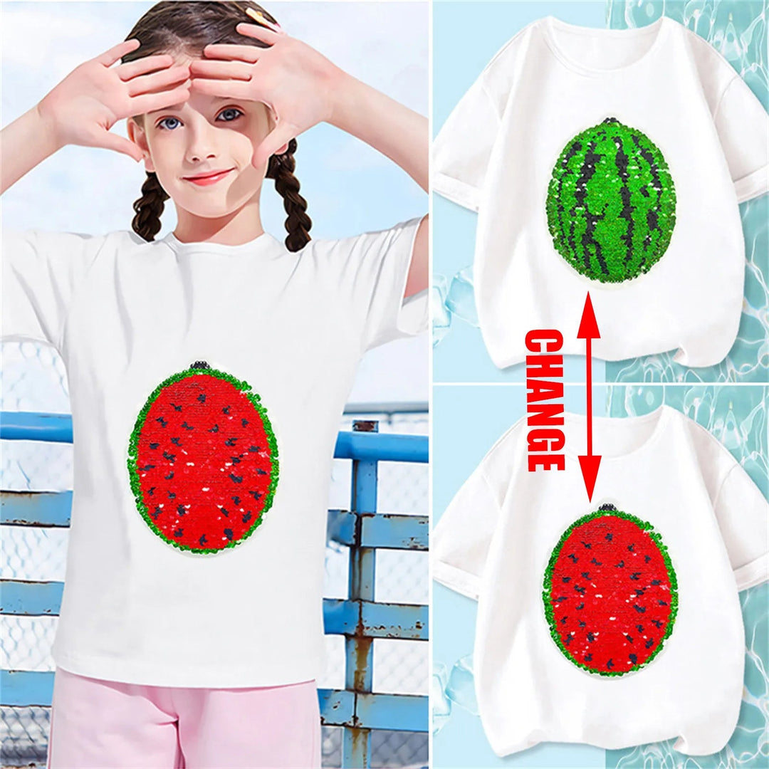 Child wearing a white watermelon sequin T-shirt beside views of its red and green designs