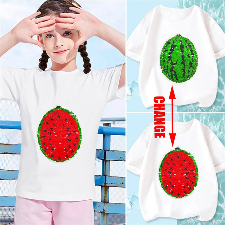 Child wearing a white watermelon sequin T-shirt beside views of its red and green designs