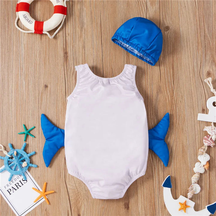 Back of the pale whale swimsuit with blue side fins and matching swim cap