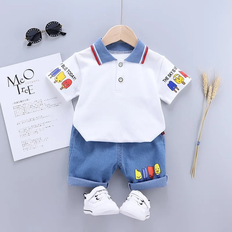 White polo with a blue collar and cartoon details paired with blue shorts