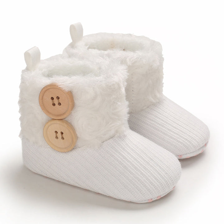 White baby boots with ribbed uppers and two decorative buttons