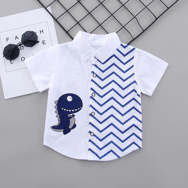 White collared button-front shirt with a dinosaur graphic and blue zigzag panel