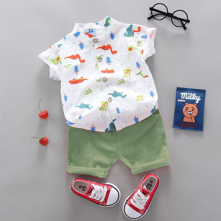 White multicolor dinosaur-print shirt with green cuffed shorts