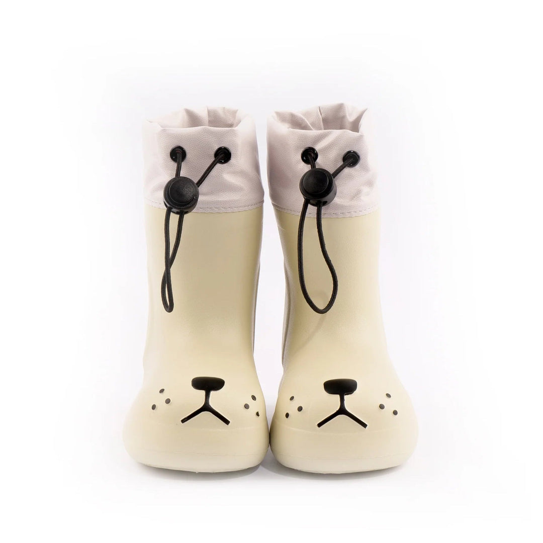 Front view of white dog-face rain boots with drawcord cuffs and black nose details
