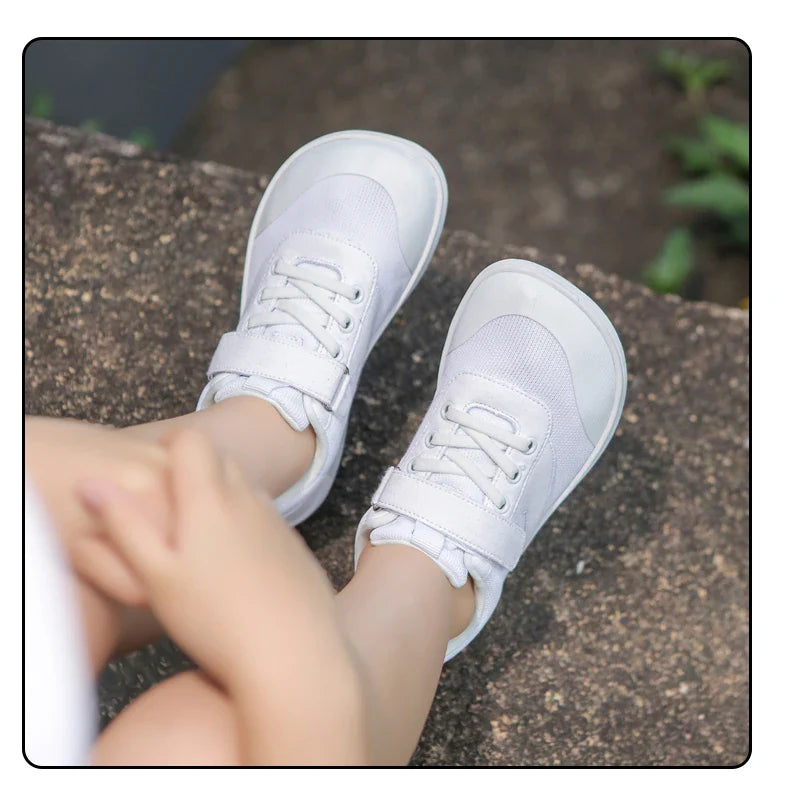 Child wearing white kids&