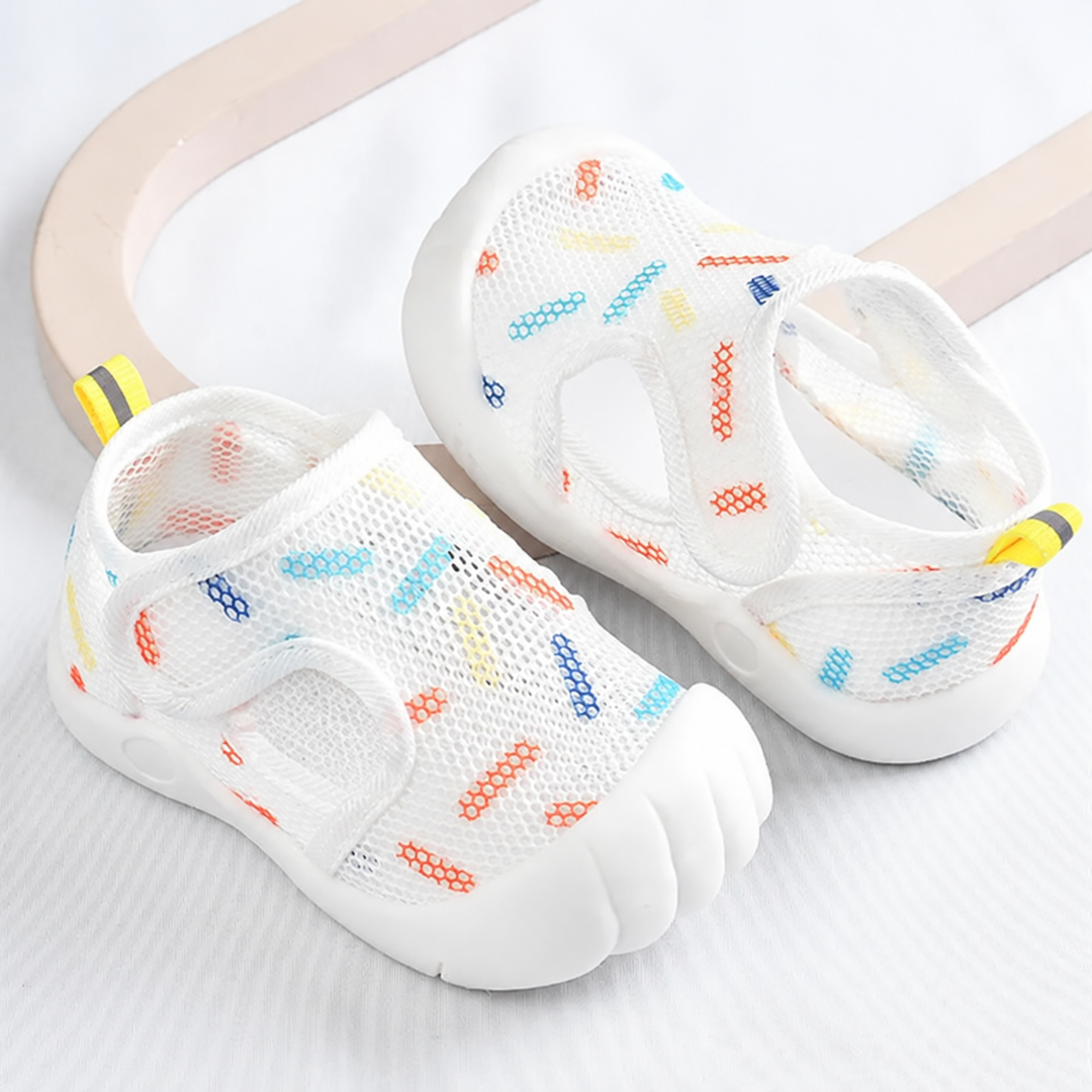 White kids' mesh sandals with colorful dash prints, closed toes and hook-and-loop straps