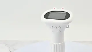 Front view of a white microscope with a color screen, buttons, and ribbed grip.