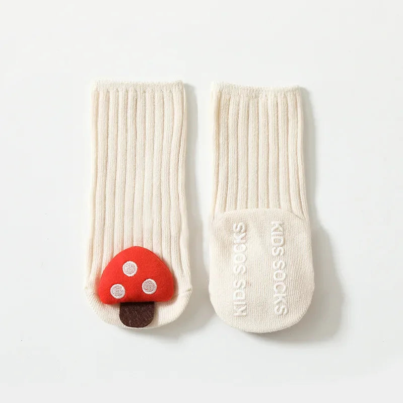 White mushroom baby socks showing ribbed cuffs and the non-slip sole