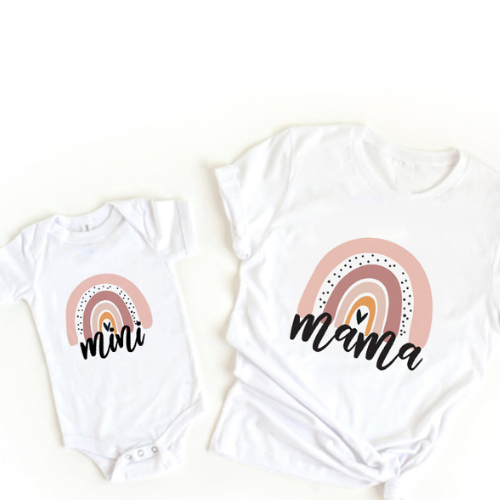 White mama T-shirt and mini baby bodysuit with muted pink rainbows and black script