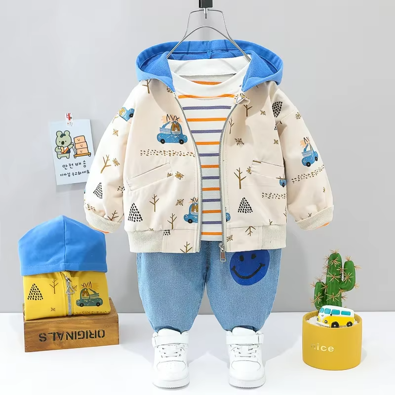 White printed jacket with a blue hood, striped T-shirt, and light blue pants
