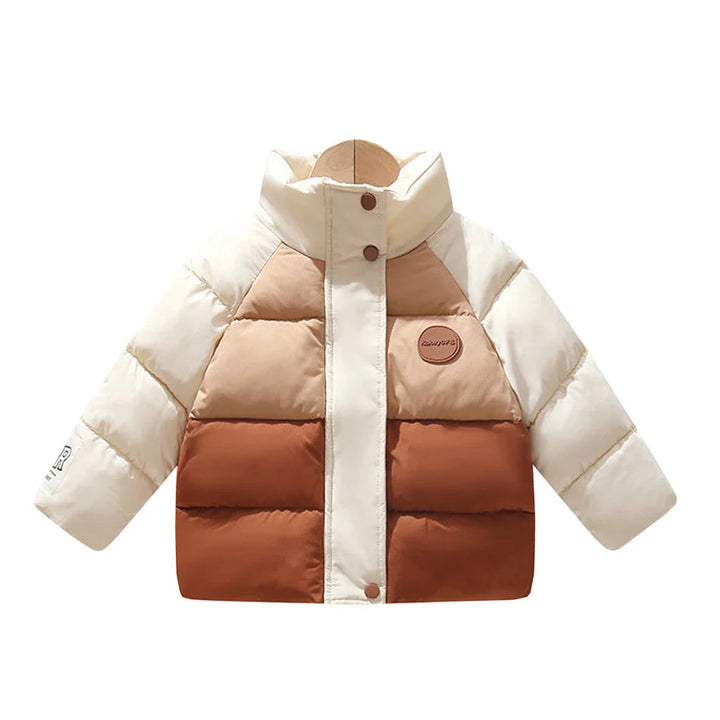 Cream, tan, and rust color-block winter coat with horizontal quilting and a front closure.