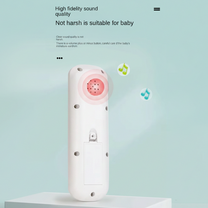 Back of a white toy remote showing its speaker and battery compartment