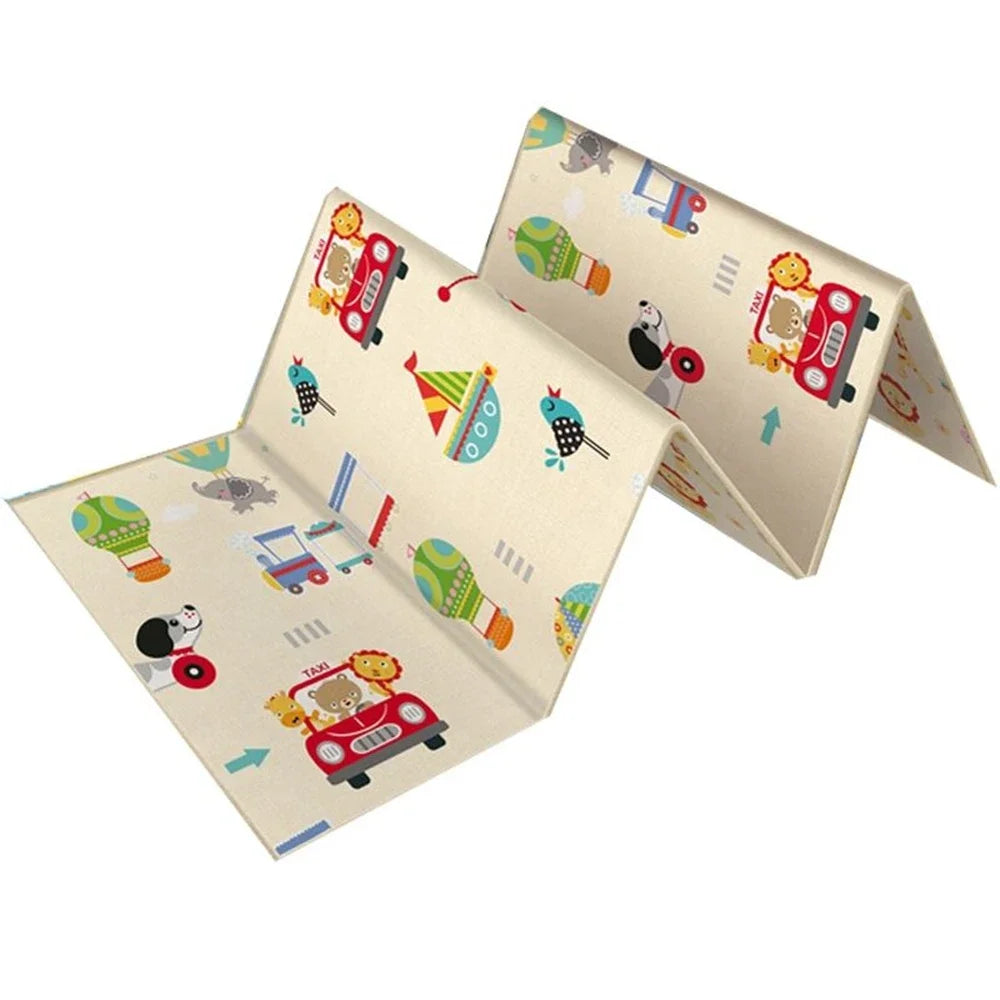 White play mat folded upright with cars, animals, and hot air balloon illustrations