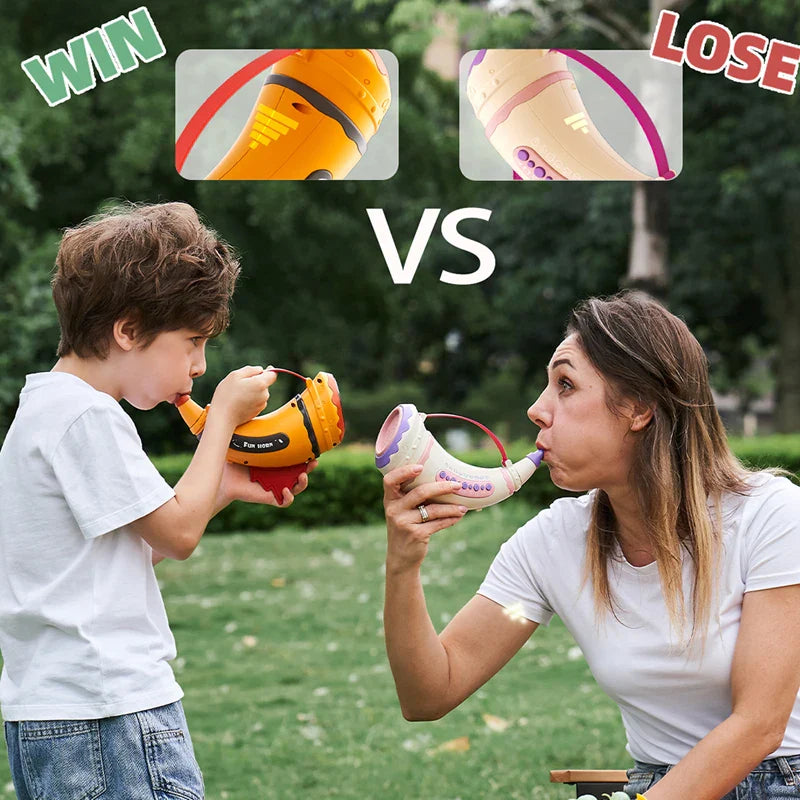 Child and adult facing each other outdoors while playing with orange and pink toy horns