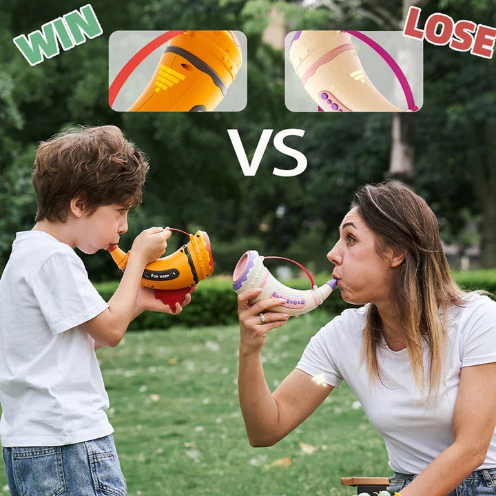 Child and adult facing each other outdoors while playing with orange and pink toy horns
