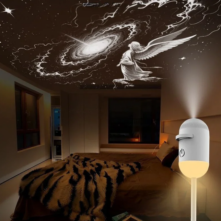 Galaxy and winged-figure ceiling projection above a bed