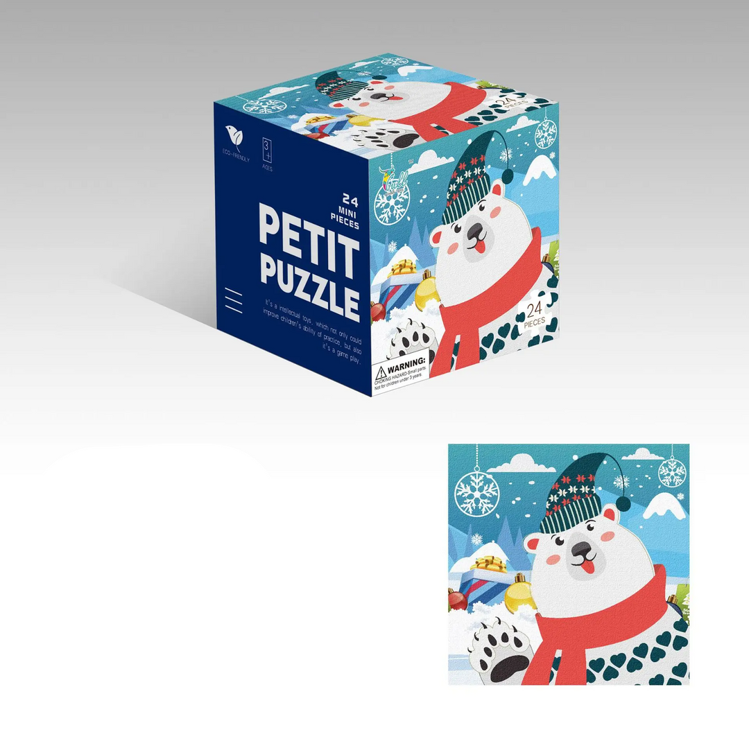 Polar bear jigsaw puzzle with snowy scenery and a matching cube box