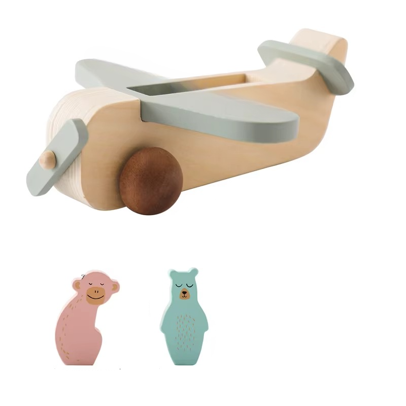 Three-piece set with a wooden airplane and separate pink and green animal figures