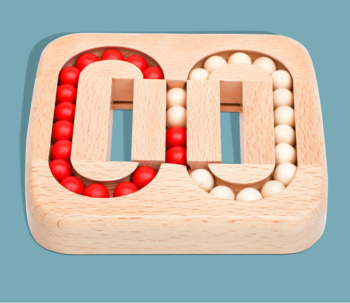 Front view of the wooden bead puzzle with oval tracks and a central bead-transfer section.