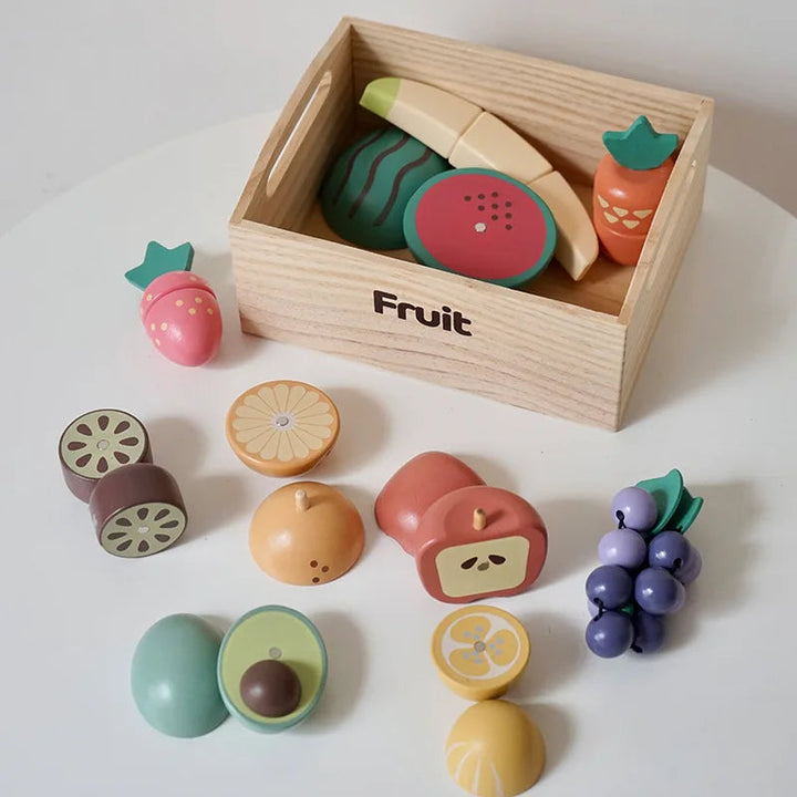 Wooden fruit play food with banana, watermelon, grapes, and a storage crate