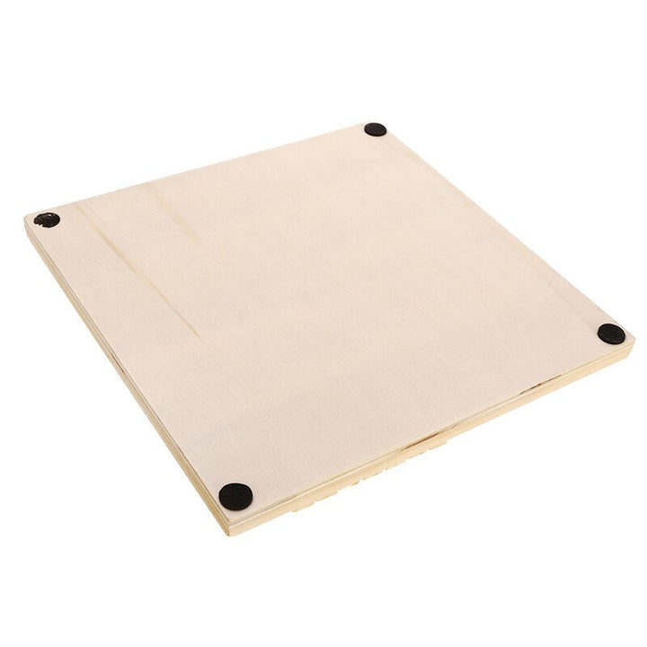Underside of the wooden board game with four round black pads