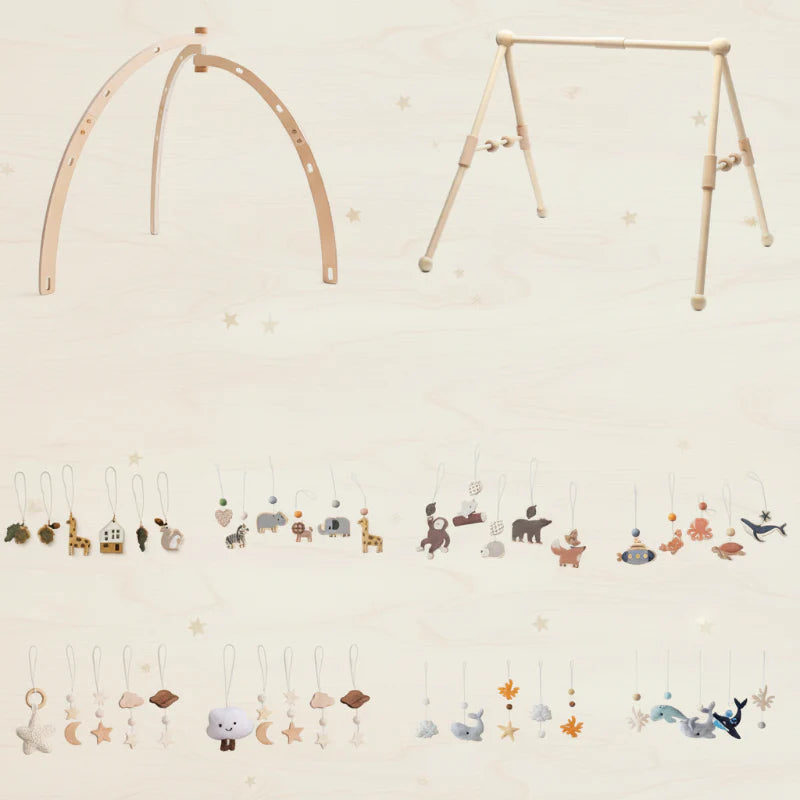 Bentwood and Classical wooden baby gym frames with a selection of themed hanging toys.