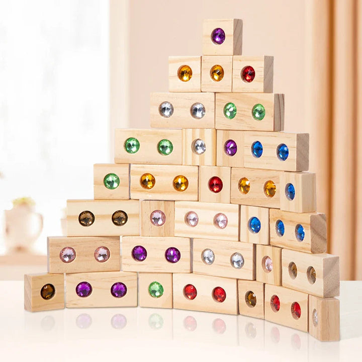Wooden blocks with colorful gems stacked into a stepped pyramid
