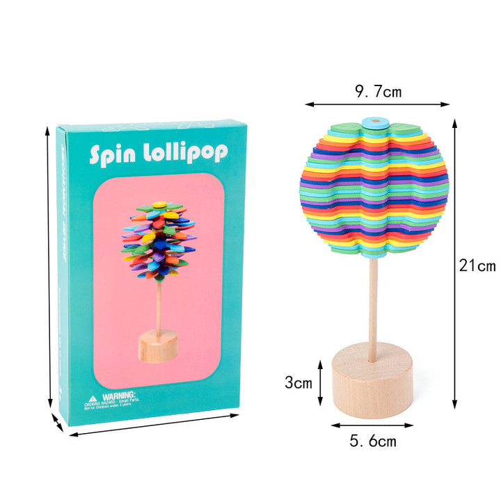Wooden rotating lollipop toy with its box and measurements for the toy&