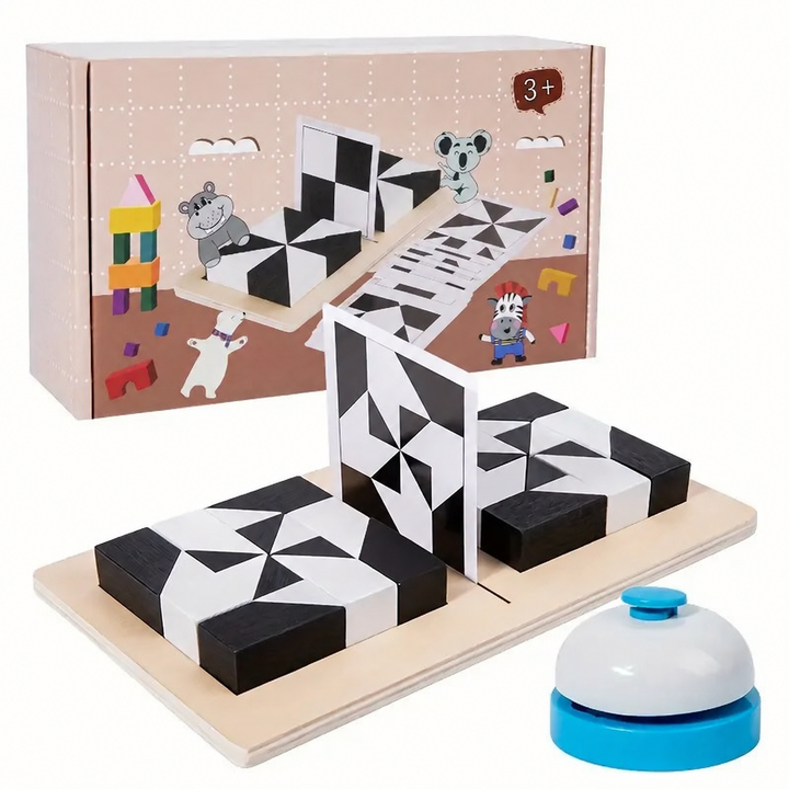 Wooden geometric puzzle set with black-and-white blocks, pattern cards, a bell, and a box