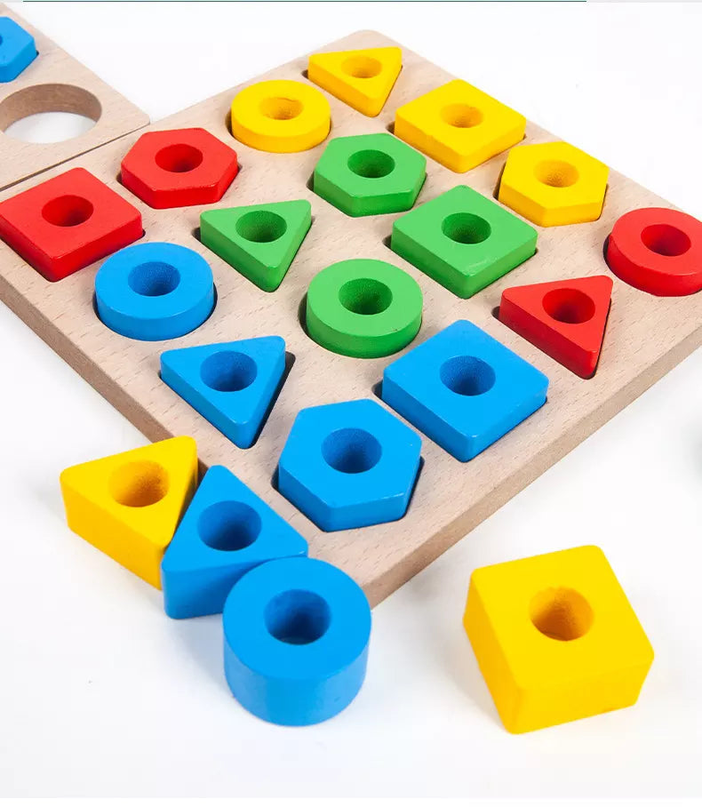 Close-up of colorful geometric blocks on a wooden shape puzzle board