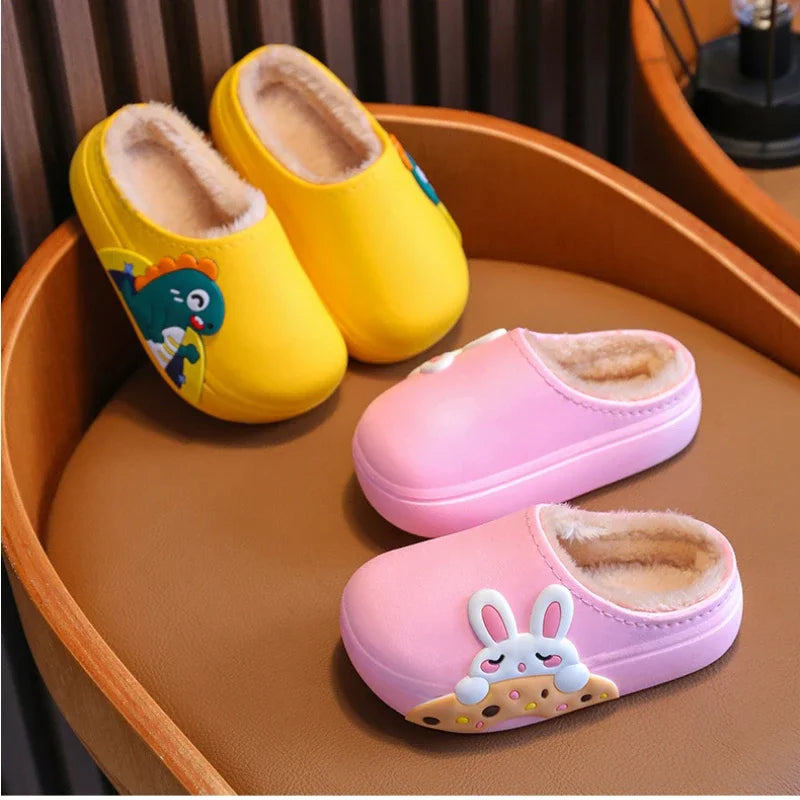 Yellow dinosaur and pink bunny slippers arranged on a wooden chair