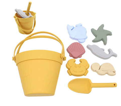 Yellow silicone beach bucket and shovel with six colorful sea-themed sand molds.