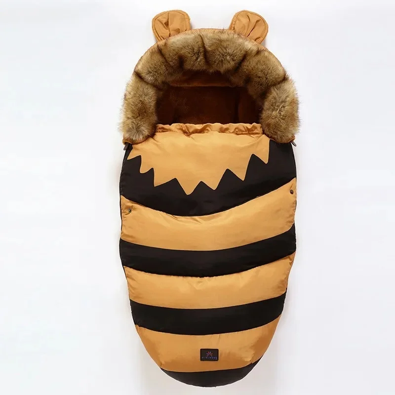 Yellow stroller footmuff with black stripes, a faux fur collar, and small ears