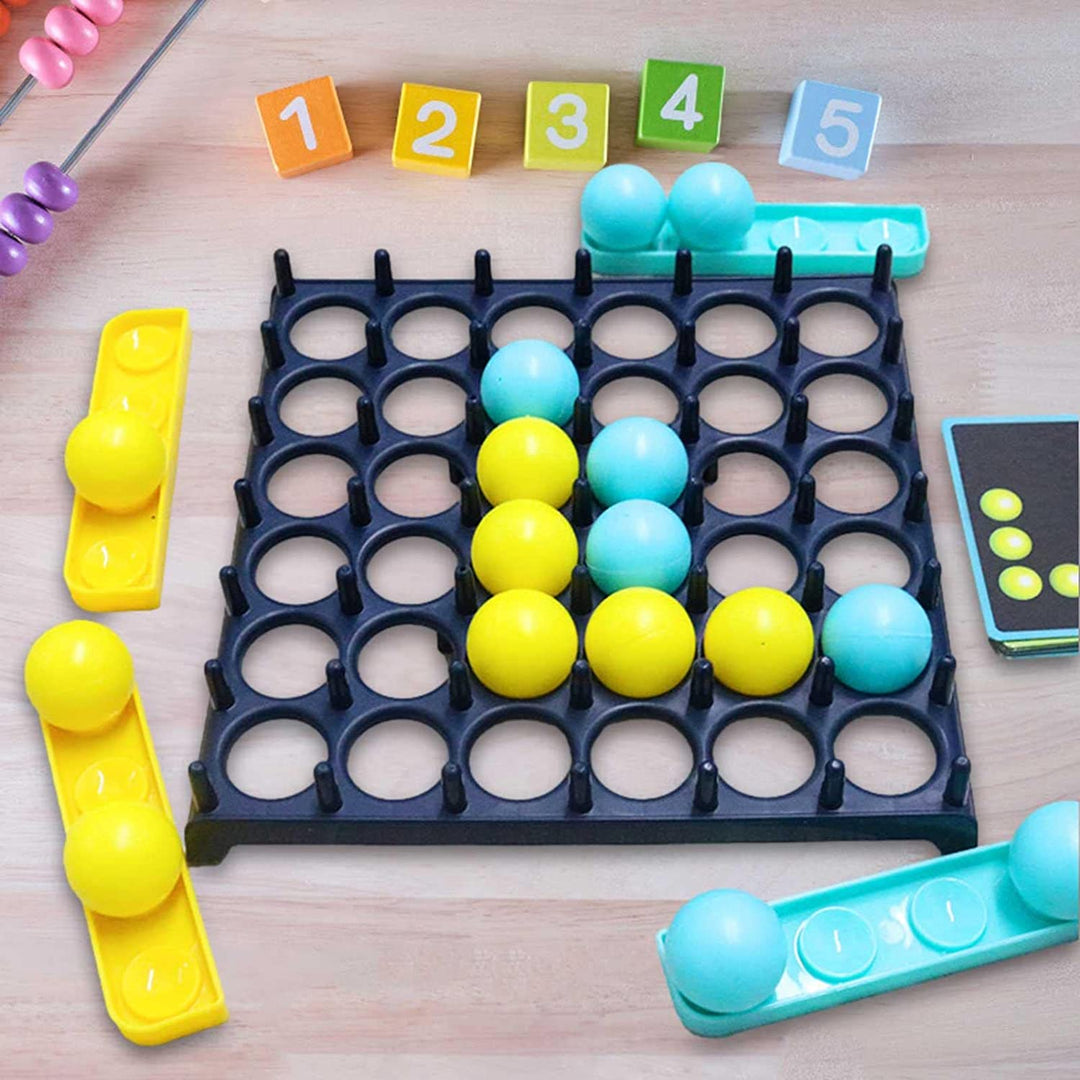 Yellow and blue balls arranged in an L-shaped pattern on the grid board beside trays and a challenge card