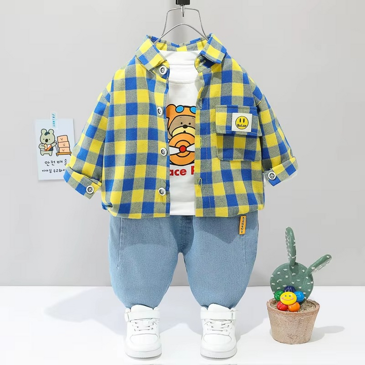 Yellow-and-blue checkered jacket over a bear-print T-shirt with light blue pants