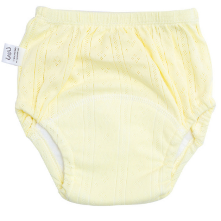 Pale yellow cotton training pants with elastic waist and leg openings.