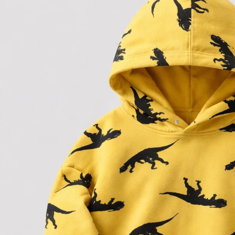 Close-up of the yellow dinosaur hoodie&