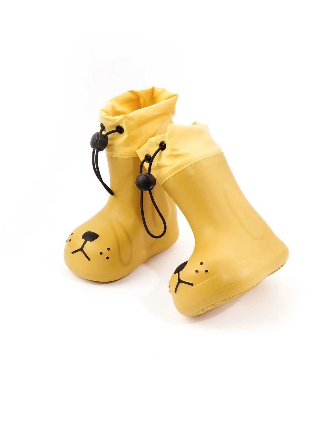 Angled view of yellow dog-face rain boots showing the faces, cuffs, and side panels