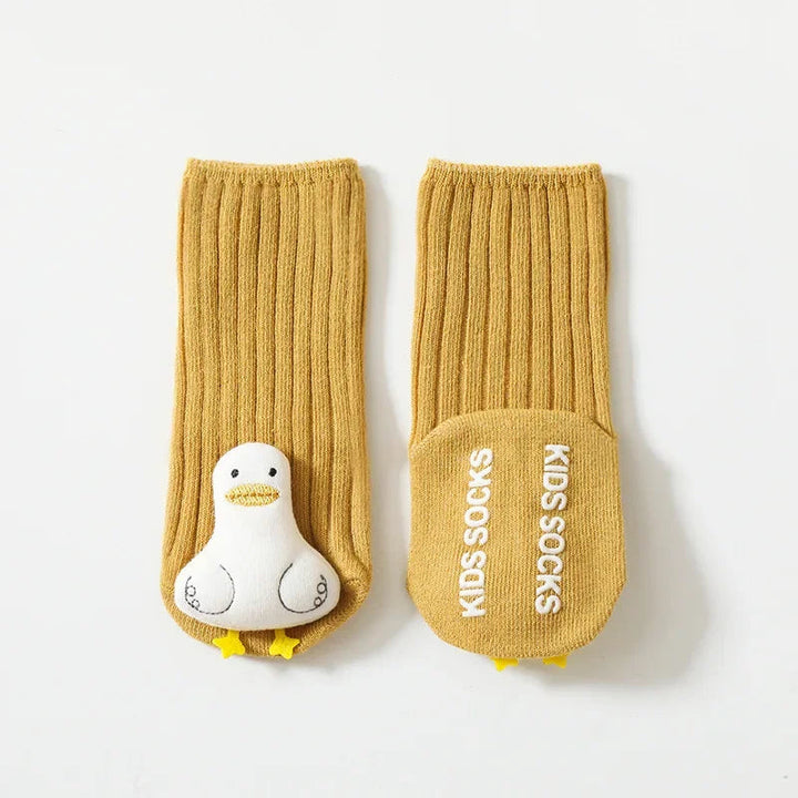 Yellow duck baby socks showing the character front and non-slip sole