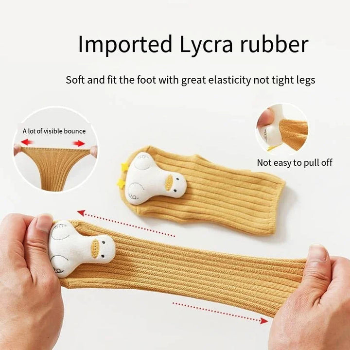 Yellow duck sock stretched by hand beside close-ups of the elastic cuff