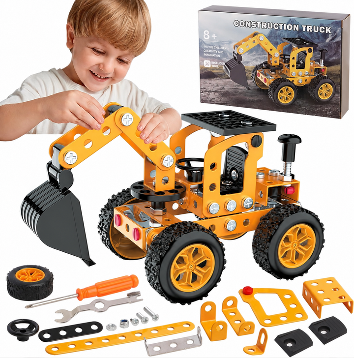 Child handling a yellow metal excavator model with loose parts and assembly tools displayed below