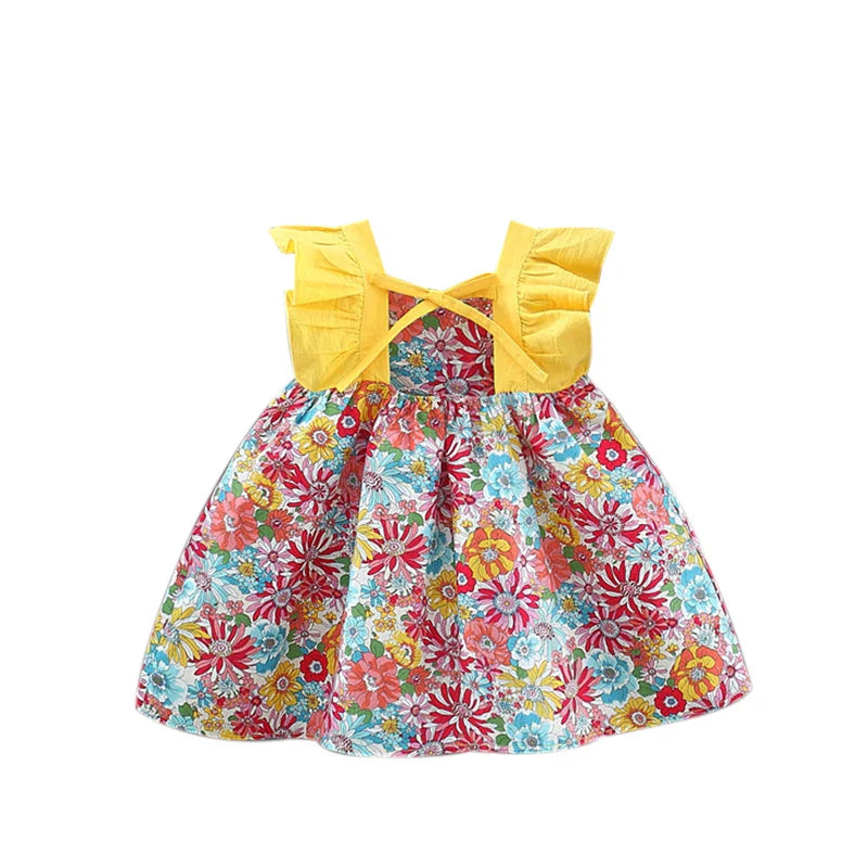 Colorful floral baby dress with yellow ruffled straps and crossed back ties